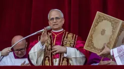 Pope Leo XIV greets the faithful gathered in St. Peter's Square on May 8, 2025 wearing the traditional garb for a new pope, a red mozzetta and a stole over a white rochet and his new white cassock. (photo: Daniel Ibanez / EWTN)