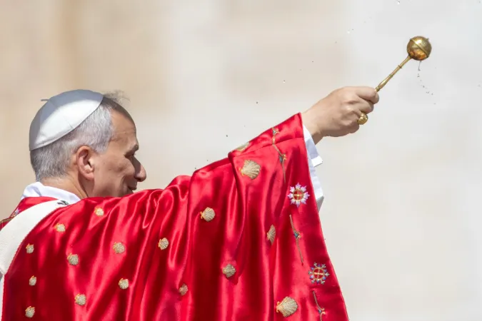 Pope Leo XIV sprinkles holy water during the rite of aspersion at the beginning of Mass for the Solemnity of Pentecost in St. Peter's Square on June 8, 2025.
