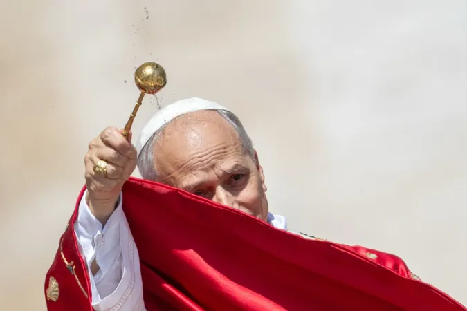 Pope Leo XIV sprinkles holy water during the rite of aspersion at the beginning of Mass for the Solemnity of Pentecost in St. Peter's Square on June 8, 2025.