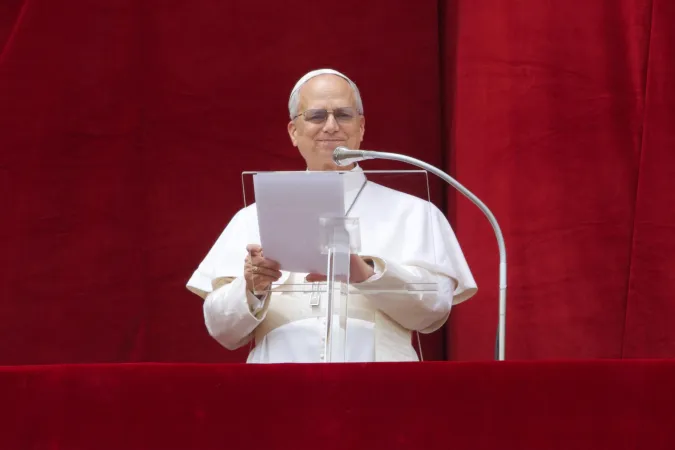 Pope Leo XIV smiles as a jubilant crowd joins in prayer on Sunday, May 11, 2025